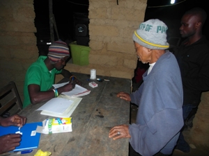 Health worker registers woman for pre-TAS in Sierra Leone