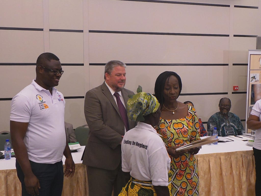 Ghana Minister of Health Hon. Sherry Ayittey and USAID/Ghana Acting Director Andrew Karas Present Award to Community Health Volunteer Madam Mary Becheyiri, who was selected as one of Ghana's NTD unsung heroes