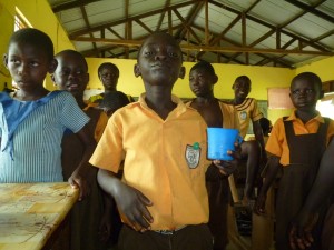 Ghanaian children bravely take medicine to prevent snail fever. Photo: FHI360