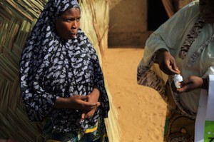 Girl receives NTD medicine in Niger. Photo: HKI