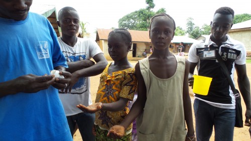 Children taking NTD prevention medicine during the 2015 mass drug administration in Sierra  Leone. Photo: FHI360