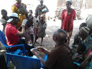 Looking for signs of trachoma in a child's eyes in Ghana. Photo: FHI 360