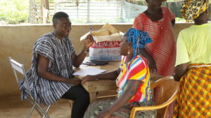 A woman registers to provide a skin sample in a 2017 onchocerciasis survey in Ghana. Photo: FHI 360