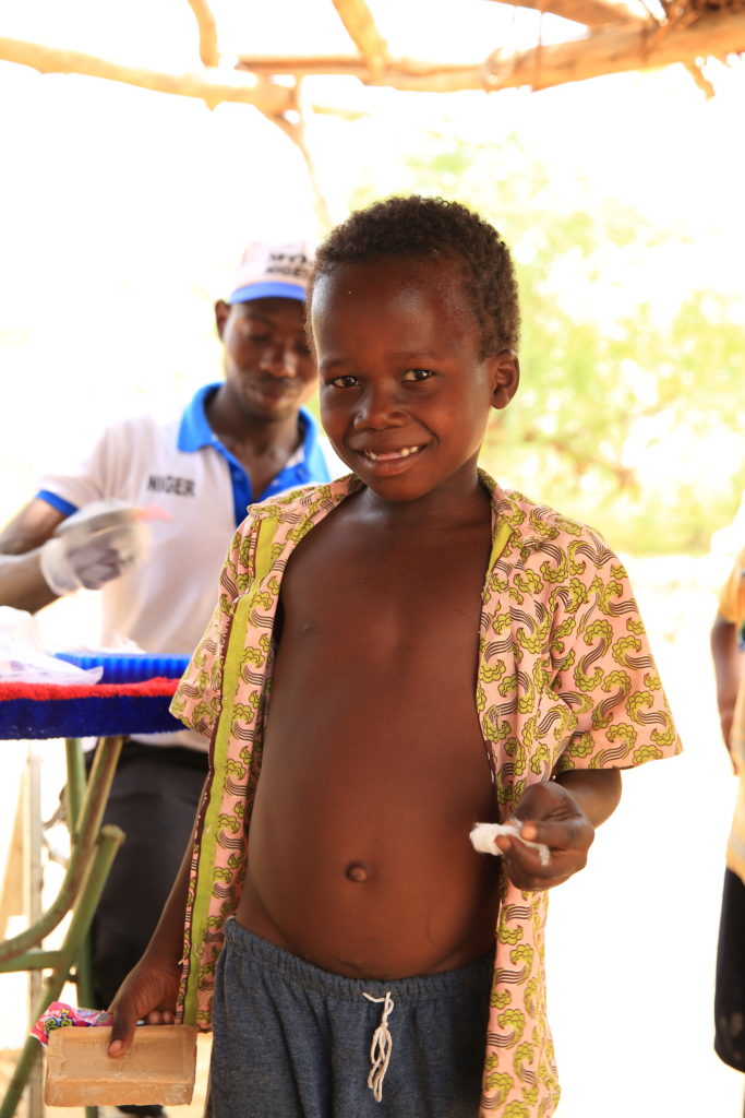Boy Proudly Shows Off HIs Bandaged Finger after Elephantiasis Test in Niger. Photo: HKI